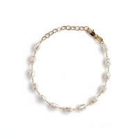 Bionda 18K gold-filled bracelet with creamy white simulated baroque pearls and an adjustable extender on a studio-white background