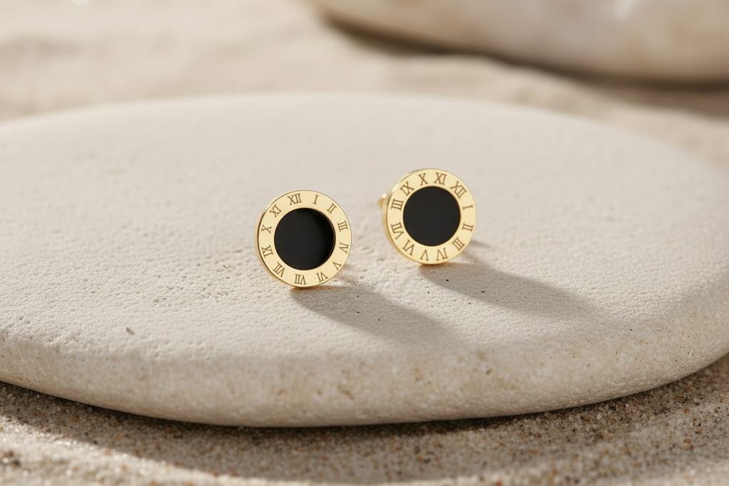 Daniella 18K Gold Plated Roman Numeral Stud Earrings - Earrings Displayed on Stone Prop | Amalfi Lane