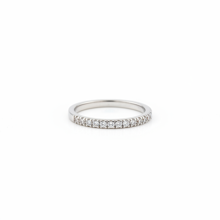 Neve rhodium plated CZ half band ring on white background