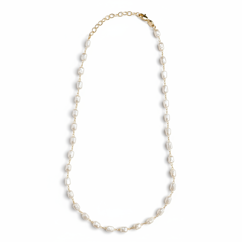 Bionda 18K gold-filled necklace with creamy white simulated baroque pearls on a studio-white background